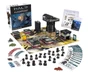 A boxed set for Halo: Flashpoint titled "Feet First into Hell" is prominently displayed, featuring artwork of soldiers in combat. Surrounding the box are 18 detailed miniatures of Orbital Drop Shock Troopers, along with a play mat depicting an urban warzone, several buildings, and various game components including dice, tokens, and cards. The scene is organized, showcasing the miniatures in a dynamic layout, emphasizing the tactical elements of the game.