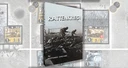 A game box for "RATTENKRIEG!" features a dramatic black-and-white image of two soldiers navigating through a war-torn landscape, emphasizing the game's focus on the Battle of Stalingrad. The title "RATTENKRIEG!" is prominently displayed in bold, white letters at the top, with the designer's name, Gottardo Zancanni, listed below. In the background, various game components, including counters and maps, are partially visible, hinting at the game's intricate mechanics and immersive experience.