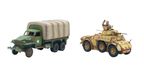 A green and brown camouflaged American Studebaker truck is positioned on the left, featuring a covered cargo area and a white star insignia on its side. Next to it, on the right, is a tan Autoblinda AB41 armored car, showcasing a rounded body and a turret, with a slightly weathered appearance. Both vehicles are detailed models suitable for tabletop gaming, reflecting their historical designs from WWII.