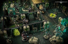 A detailed tabletop gaming scene features a futuristic battlefield with intricate terrain and structures. In the foreground, two armored figures wielding weapons stand ready, while several robotic Necron warriors are positioned strategically among the ruins. The environment is characterized by dark green and metallic colors, with glowing elements and a circular control panel in the center, enhancing the sci-fi atmosphere.