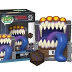 A Funko POP collectible features a Dungeons and Dragons Mimic designed as a treasure chest with a wide, gaping mouth filled with sharp teeth and a long, purple tongue. The Mimic is brightly colored, with orange accents on top, and is accompanied by a D20 die in front, showcasing intricate designs. The packaging displays the Funko logo and the number "423," indicating its series.