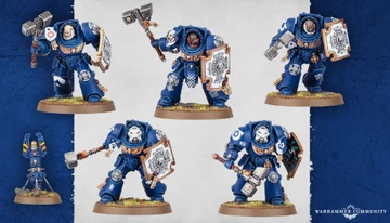 Five Space Marine Assault Terminators are displayed, each wearing iconic blue power armor and equipped with various weapons, including thunder hammers and storm shields. The miniatures feature detailed designs, with some having unique head options and tilting plates adorned with purity seals and badges. The background is a subtle gradient, enhancing the focus on the intricately crafted models.