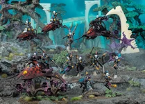 A dynamic scene showcases a group of Harlequin miniatures from Games Workshop, featuring vibrant colors and intricate details. The display includes two Skyweavers and a Starweaver, with Harlequin models in various poses, some wielding weapons and others in dramatic stances. The background features a fantastical landscape with alien flora, enhancing the colorful and theatrical theme of the Harlequins.