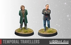 A pair of miniature figures titled "Temporal Travellers" stands on a textured base with tufts of grass. On the left, a figure in a green coat and vest has curly hair and a confident stance, while on the right, a figure in a black jacket with crossed arms and short hair presents a more serious demeanor. The background features a subtle starry effect, enhancing the theme of time travel.