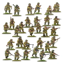 A collection of multi-part plastic miniatures representing US Airborne soldiers in early war, reinforced M42 jump uniforms. The figures are posed in various action stances, showcasing a range of weapons including rifles, submachine guns, and a bazooka, along with additional gear like magazine pouches and a signal lamp. The miniatures are set on grassy bases, highlighting their detailed sculpting and variety within the thirty-man platoon.