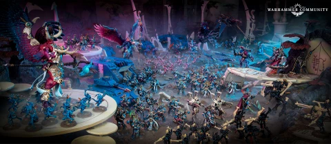 A dynamic scene showcases a variety of Warhammer 40,000 miniatures, prominently featuring the new Sekhetar Robots in the foreground, equipped with menacing weaponry. Surrounding them are various Thousand Sons units, including sorcerers and infantry, all set against a richly detailed, otherworldly backdrop with vibrant colors and intricate terrain. The composition highlights the mechanical and mystical elements of the Thousand Sons army, emphasizing their formidable presence on the battlefield.