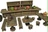 A detailed collection of 3D-printed tavern furniture, featuring a wooden bar with shelves displaying various colorful pots and jugs in shades of green, orange, and brown. The scene includes several tables and stools, all crafted to resemble rustic wooden furniture, with a round table holding a small dish and a black bottle. The overall design evokes a cozy, fantasy tavern atmosphere, perfect for tabletop RPG settings.