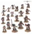 A collection of 20 miniature figures representing the Black Templars from the Warhammer 40,000 universe, arranged on a light-colored surface. The models are predominantly clad in black armor with red and white accents, showcasing various weapons such as swords, bolters, and shields. Some figures are posed dynamically, while others stand in more static positions, highlighting their distinct roles within the chapter, including a prominent figure likely representing the Emperor’s Champion.