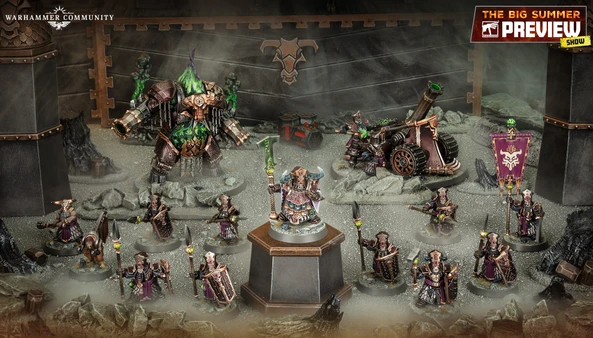 A detailed display of the new Zharrdron army features various miniatures set against a dark, industrial backdrop. In the center, a prominent War Despot stands on a pedestal, clad in imposing armor and wielding a staff, surrounded by Infernal Cohorts holding spears. To the left, a large, menacing Dominator Engine looms, while a mortar-like Tormentor Bombard is positioned on the right, showcasing the army's dark and chaotic aesthetic.
