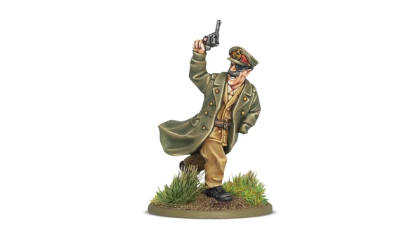 A miniature figure of Lieutenant-General Sir Adrian Carton de Wiart VC is depicted in a dynamic pose, raising a revolver in one hand while wearing a military uniform complete with a long coat and a peaked cap adorned with insignia. The figure stands on a circular base featuring tufts of grass and earthy terrain, emphasizing a battlefield setting. The detailed paintwork highlights his facial features, including a mustache and sunglasses, capturing a spirited and commanding presence.