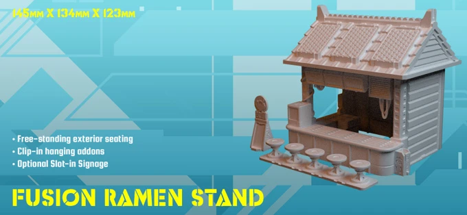 A small, single-floor building designed as a ramen stand, featuring a traditional roof and an open front. It includes free-standing exterior seating, clip-in hanging addons, and optional slot-in signage. The structure is presented in a light color against a blue geometric background, with dimensions noted as 145mm x 134mm x 123mm.