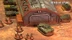 A detailed tabletop scene features a large, industrial building with a corrugated roof and a prominent garage door, set against a textured, sandy ground. In the foreground, several infantry miniatures are arranged in a semi-circle, while a green tank is positioned nearby, showcasing intricate details. Behind the building, additional vehicles are lined up, contributing to the military theme of the setting, with the "Revelations: Skirmish" logo visible in the top right corner.