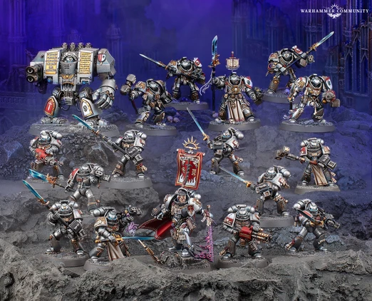 A detailed display of Black Templar miniatures showcases a variety of armored figures in silver and black, set against a dark, rocky backdrop. Prominent in the scene is a Venerable Dreadnought on the left, flanked by a mix of characters including the Emperor’s Champion, Bladeguard Veterans, and Sword Brethren, all wielding swords and other weapons. The figures are intricately painted, with some holding banners and others poised for battle, creating a dynamic and imposing presence.
