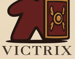 A stylized logo features a red game piece resembling a Roman soldier, complete with a golden helmet and a shield adorned with a decorative emblem. Below the figure, the word "VICTRIX" is displayed in bold, dark lettering. The background is a light beige color, enhancing the logo's vibrant elements.