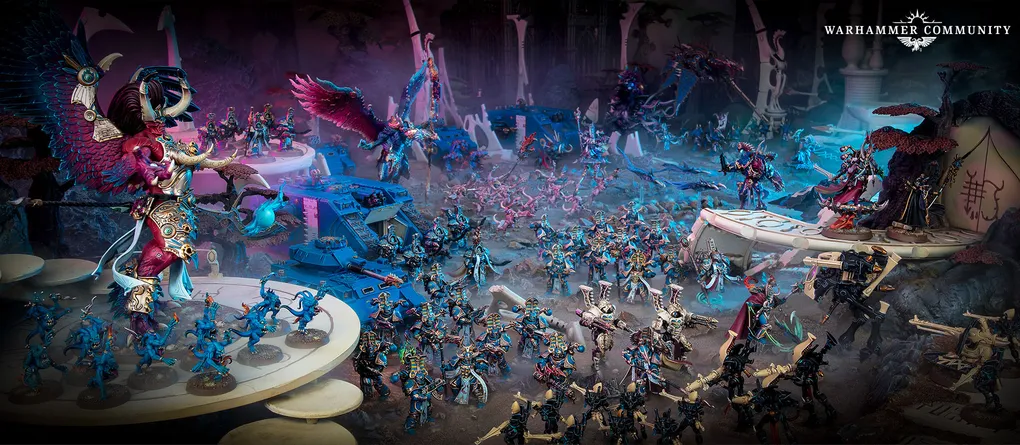 A dynamic scene showcases a variety of Warhammer 40,000 miniatures, prominently featuring the new Sekhetar Robots in the foreground, equipped with menacing weaponry. Surrounding them are various Thousand Sons units, including sorcerers and infantry, all set against a richly detailed, otherworldly backdrop with vibrant colors and intricate terrain. The composition highlights the mechanical and mystical elements of the Thousand Sons army, emphasizing their formidable presence on the battlefield.