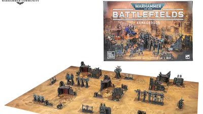A Warhammer 40,000 tabletop scene with pre-painted plastic terrain. Includes buildings, ruins, and scattered figures in futuristic armor. A rectangular gaming board with a beige surface and printed grid lines. Box cover shows "Warhammer 40,000 Battlefields: Armageddon" with chaotic battle scene.