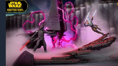 The image features a dynamic scene from the Star Wars: Shatterpoint game, showcasing miniatures of Ahsoka Tano and Darth Vader engaged in a duel. Ahsoka, wielding two lightsabers, is positioned in an action pose, while Darth Vader stands menacingly with his red lightsaber drawn. The backdrop includes a detailed scenic terrain piece resembling a Sith temple, with swirling purple energy and mist adding to the dramatic atmosphere of their confrontation.