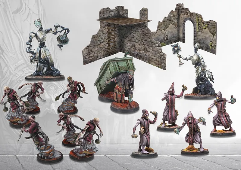 Miniature figures, stone ruins, and a green dumpster on a gray tiled floor.