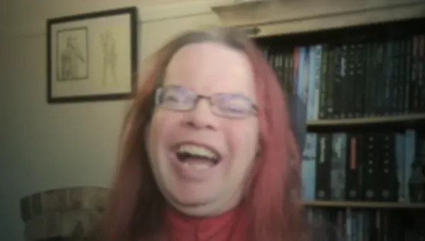 The woman on the top has long, dark hair and is wearing a black top, while the man on the bottom has medium-length, reddish hair and is wearing glasses. Below them, text reads, "to get immune to the stabbing," suggesting a humorous or lighthearted context. In the background, bookshelves filled with various books are visible behind the  man on the bottom.