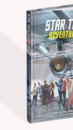 A roleplaying game sourcebook titled "Star Trek Adventures" features a colorful cover with a futuristic starship and various characters in a sci-fi setting. The characters, including humanoids of different species, are depicted in a range of outfits, suggesting a diverse crew. The title and subtitle are prominently displayed at the top and bottom, with the publisher's logo visible on the spine.