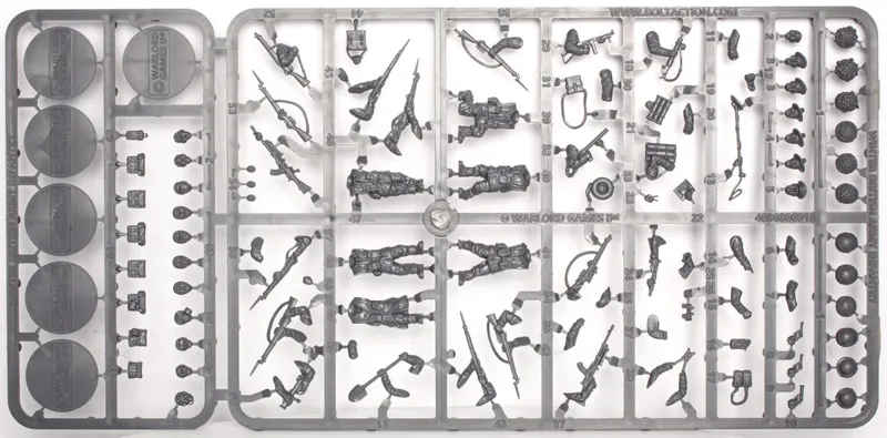 A sprue featuring multi-part figures of British and Canadian winter infantry, showcasing six distinct soldier poses, all equipped with various winter gear. The sprue includes an assortment of weapons such as rifles, machine guns, SMGs, and specialist items like sniper rifles, mortars, and flamethrowers, along with engineering tools like shovels and mine sweepers. The figures are intricately detailed, emphasizing their readiness for winter conditions.