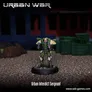 Miniature figure of a green-armored soldier with yellow shoulder wings, standing on a round base, posed in an urban setting with a blue building and green crates in the background. Text reads: "URBAN WAR" at top, "Urban Interdict Sergeant" at bottom, and "www.seb-games.com" in the corner.