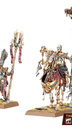 A pair of undead miniatures from the Old World are featured, showcasing a Royal Herald on foot and a mounted Liche Priest. The Royal Herald holds a staff adorned with intricate designs and a scroll, while the Liche Priest, also detailed with vibrant colors and accessories, carries a staff topped with a skull. Both figures are set on textured bases with tufts of grass, emphasizing their ancient and mystical theme.