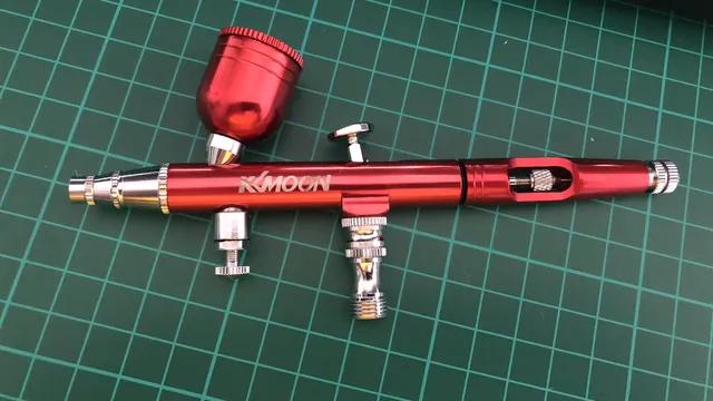 kkmoon airbrush in anodised red on a cutting mat