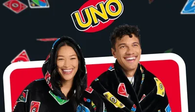 Two people in UNO-themed hooded blankets, with UNO logo and cards in background. Text: "Game night sorted"