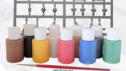 A collection of nine bottles of water-based acrylic paints in various colors, including black, white, dark green, mid blue, bright red, golden yellow, leather brown, bright gold, and chain mail, is displayed in the foreground. Behind the paint bottles is a sprue containing two Viridian Interdicts Marines, showcasing various miniature parts. A high-quality synthetic brush is positioned in front of the paint bottles, emphasizing the set's painting essentials.