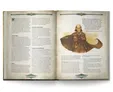 Open book with text and illustration of a cloaked, elderly man with a staff.
