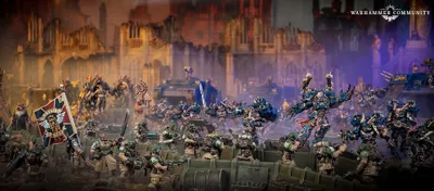 A dynamic scene features a group of intricately detailed Warhammer 40,000 miniatures engaged in battle. In the foreground, several armored soldiers in green uniforms are positioned behind a barricade, aiming their weapons. In the background, imposing figures in dark blue armor, adorned with spikes and intricate designs, advance menacingly, showcasing a mix of futuristic and gothic architecture in the blurred backdrop.