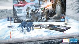 The image features the box art for "Star Wars: Battle of Hoth," showcasing a snowy battlefield scene with Rebel soldiers in action, equipped with blasters and wearing winter gear. In the foreground, two AT-AT walkers are positioned alongside game components, including cards and dice, set on a hexagonal game board. The title "BATTLE OF HOTH" is prominently displayed at the top, with branding from Asmodee and Days of Wonder visible in the corners.