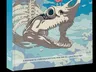 Book cover for "Obojima: Tales from the Tall Grass." A large, light gray skeletal fish head with sharp teeth and an open mouth dominates the lower half of the cover. A young girl with red hair, wearing a pink dress, stands on the fish's upper jaw, looking towards the right. The background is a bright blue sky with fluffy white clouds. The title "OBOJIMA" is prominently displayed in white text at the top, with the subtitle "Tales from the Tall Grass" in smaller white text below it. Additional text in a different script appears next to the subtitle. The spine of the book on the left side also displays the title "OBOJIMA" vertically in white text.