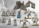 Miniature fantasy warriors and a stone tower with a wooden roof.
