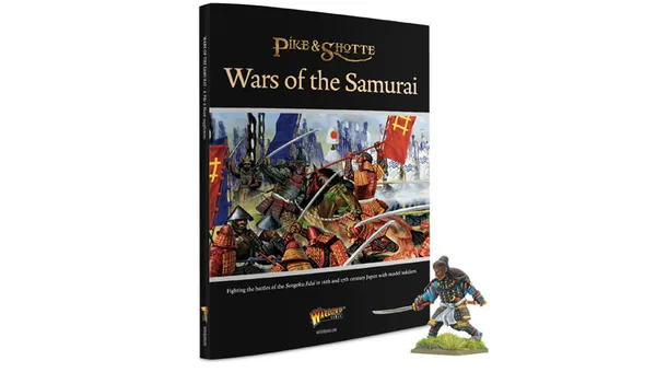 The image features the cover of the "Wars of the Samurai" supplement for the Pike & Shotte tabletop game, prominently displaying a vibrant illustration of a 15th and 16th-century Japanese battle scene, complete with samurai warriors in traditional armor wielding weapons and banners. To the right, there is a detailed miniature of Yasuke, the Black Samurai, depicted in a dynamic pose, dressed in colorful armor and holding a sword. The book's title is elegantly printed in gold lettering at the top, with the Warlord Games logo at the bottom.