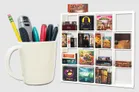 A white ceramic cup filled with pens and a stapler sits on the left. To the right is a white grid-style shelf holding multiple small board game boxes, including visible titles such as "GLOOMHAVEN", "MARS", "POTION EXPLOSION", "DICED VEGGIES", "TERRAFORMING MARS", "CUBITOY", "Sleeping Gods", and others.