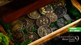 A wooden box filled with metal coins featuring intricate designs, including symbols like a crescent moon, crowns, and shields. Green moss-like material lines the box. Overlay text reads: "FUNDED IN 2 HOURS" and "Legendary Metal Coins Season 9."