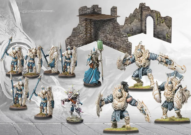 Miniature fantasy warriors and a stone tower with a wooden roof.