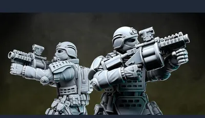 Two detailed miniatures from Anvil Industry's Special Forces range are positioned back-to-back, each holding futuristic firearms. The figures are clad in tactical armor with various pouches and equipment, showcasing a blend of sleek design and functionality. The miniatures are presented in a gray, unpainted finish, highlighting their intricate details and dynamic poses.