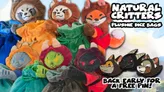 A collection of colorful plushie dice bags, designed to resemble various critters, is prominently displayed. The bags feature animal designs, including a red panda, fox, and other whimsical creatures, each with a drawstring closure. The text "NATURAL CRITTERS PLUSHIE DICE BAGS" is featured at the top, along with a promotional note encouraging early backing for a free pin.