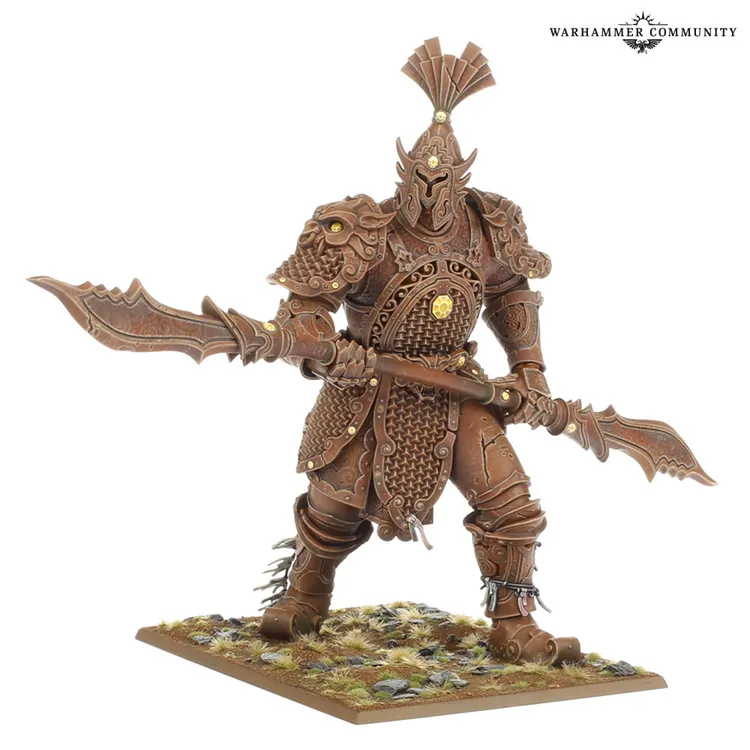 A detailed miniature of a Jade Warrior from Grand Cathay stands prominently, showcasing intricate armor with a scale pattern and ornate decorations. The warrior wields a pair of curved blades, poised for battle, and is set on a textured base featuring grass and rocks. The overall color scheme is a rich brown, highlighting the craftsmanship and design of this new addition to the Warhammer universe.