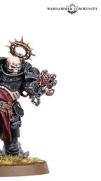 A Black Templars Execrator stands in a dynamic pose, wielding a large, ornate power hammer in one hand and a pyre pistol in the other. The figure is clad in black armor adorned with gold and silver details, including a skull motif on the helmet and a purity seal on the chest. The base features a grassy terrain with scattered skulls, enhancing the grim aesthetic typical of the Warhammer 40,000 universe.