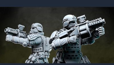 Two detailed miniatures from Anvil Industry's Special Forces range are positioned back-to-back, each holding futuristic firearms. The figures are clad in tactical armor with various pouches and equipment, showcasing a blend of sleek design and functionality. The miniatures are presented in a gray, unpainted finish, highlighting their intricate details and dynamic poses.