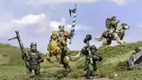 A group of halfling miniatures stands on a grassy terrain, showcasing their unique characteristics. In the center, a halfling in ornate armor rides a large, lion-like creature, holding a blue and white banner. To the left, another halfling wields a spear, while a third, dressed in green, brandishes a hammer. A fourth halfling rides a smaller, dog-like creature, completing the ensemble of pint-sized warriors. The background features a soft blue sky with scattered clouds, enhancing the whimsical atmosphere.