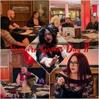 A collage of images from Vampire Games Day II showcases various participants engaged in tabletop roleplaying games in a gothic setting. In the top left, a group of players sits around a table, with a portrait hanging on the wall behind them. The center features a participant with cat-like ears extending a hand, while the bottom left shows a storyteller in a red vest leading a session. The bottom right highlights a player in a black lace outfit, all set against a backdrop of elegant wooden decor and ambient lighting. The title "Vampire Games Day II" is prominently displayed in a bold, red font across the collage.