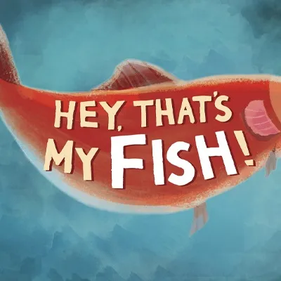 A stylized illustration of a fish, prominently featuring the title "HEY, THAT'S MY FISH!" in bold, playful lettering. The fish is depicted in a vibrant reddish-orange color with a slightly whimsical design, set against a soft, blue-toned background that suggests an underwater environment. The overall composition conveys a fun and engaging theme, suitable for a family-friendly board game.