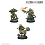 Three intricately designed miniatures from the Trench Crusade: Carcass Front game are displayed. On the left, a character in a tattered robe and armor, wielding a weapon with a flame, stands on a rocky base. The center figure, dressed in a hooded cloak, holds a spear-like weapon, while the rightmost miniature, wrapped in bandages, grips a large, circular weapon. Each model showcases detailed paintwork and unique features, emphasizing the grimdark aesthetic of the game.