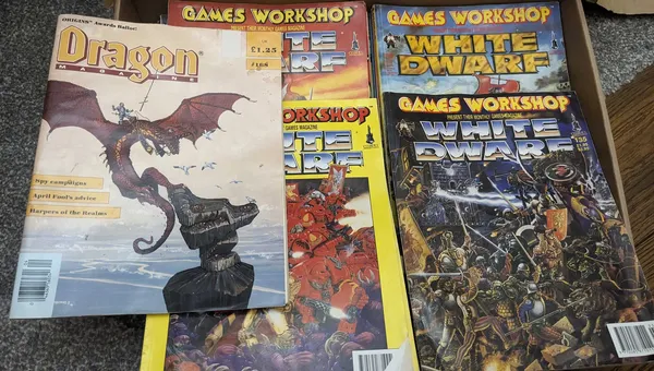 A selection of eary 90s white dwarf and dragon magazines showing the classic stylings