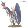 A Greater Daemon of Tzeentch miniature with purple wings, golden armor, and a serpentine tail. Holds a staff, standing on a textured base. Logo reads "Warhammer Community."